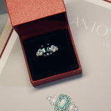 Designed by London based engagement ring designer Antonia Guise. A unique unheated 6.06ct teal sapphire engagement ring in its box alongside hand drawn original designs for the ring.